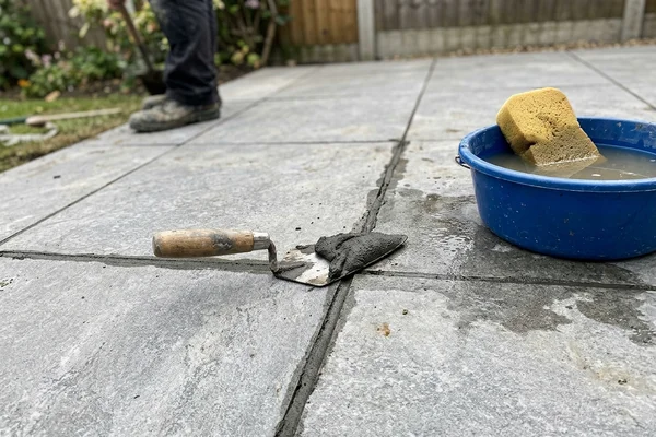 Close-up of polymer mortar jointing between grey porcelain slabs