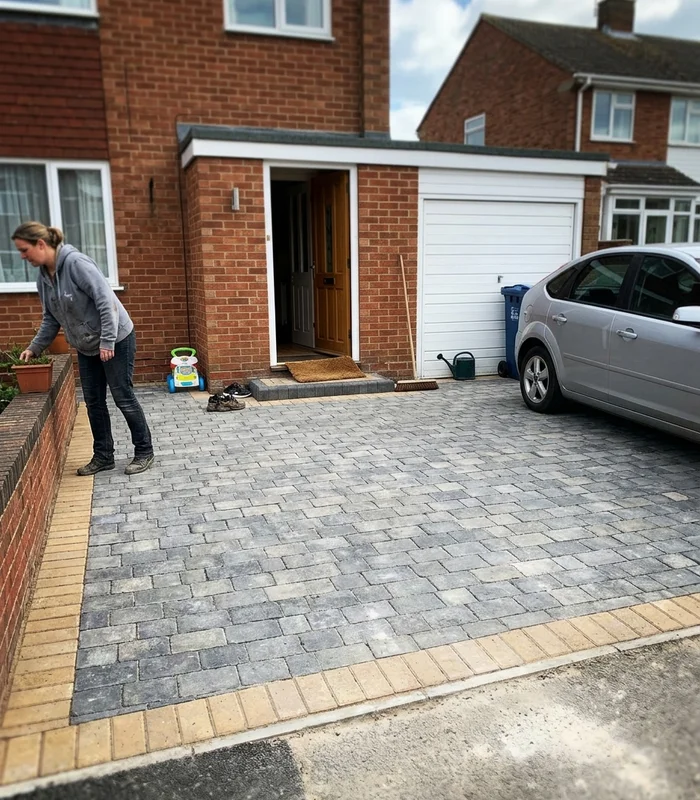 Finished driveway with a clean swept surface and neat border edging in Gloucester