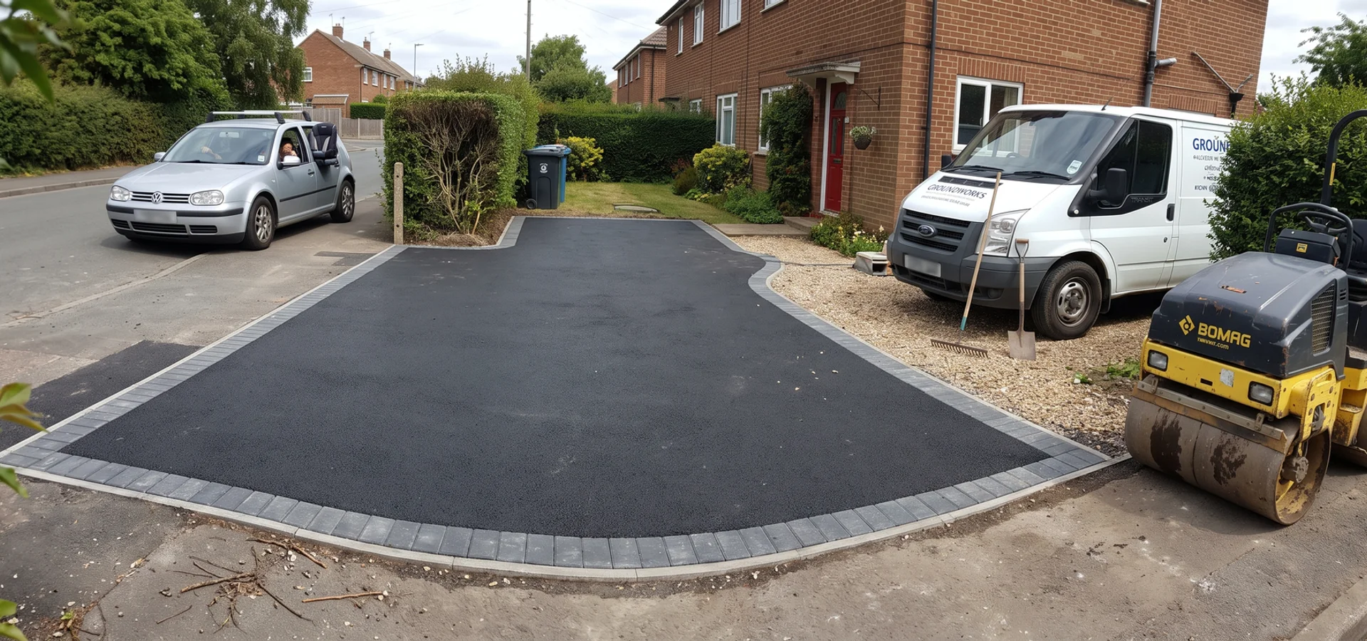 Freshly laid tarmac driveway with a block paved border outside a Gloucester home